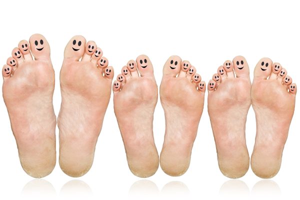 Smile.,The,Large,And,Small,Feet.,Isolated,Over,White,Background